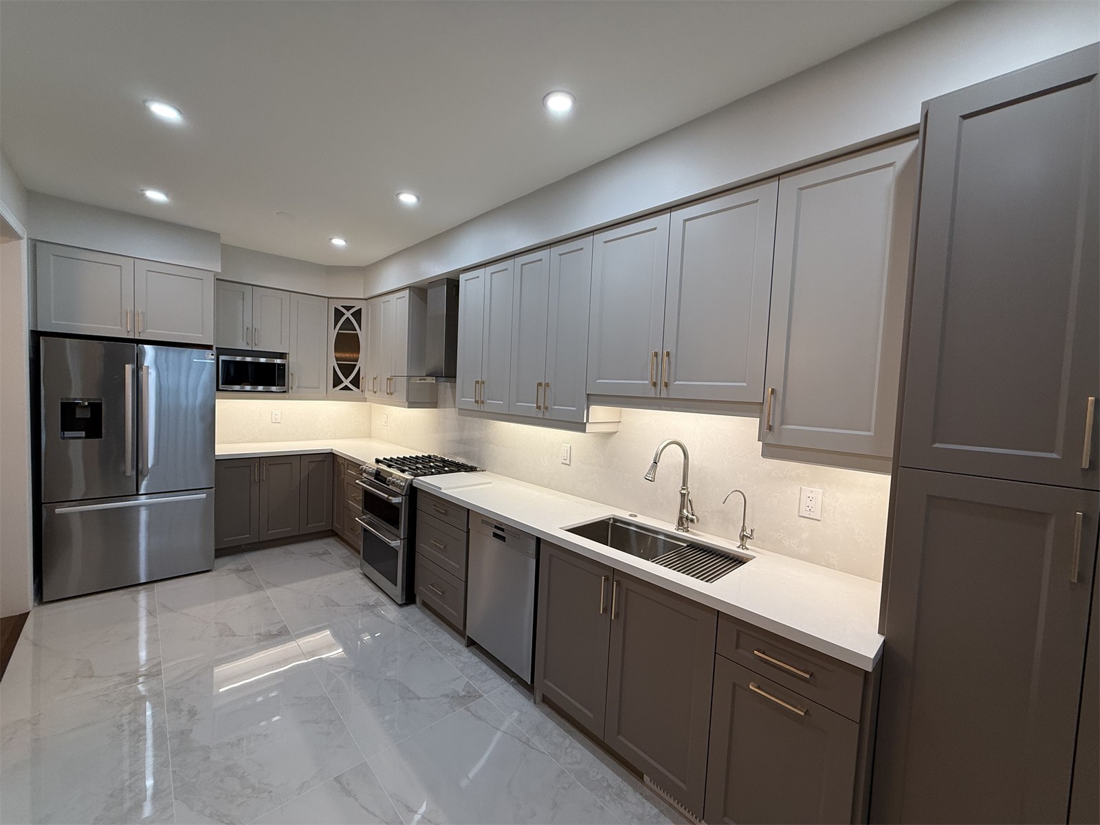 Long perspective view from the sink side through the full Oakville kitchen renovation